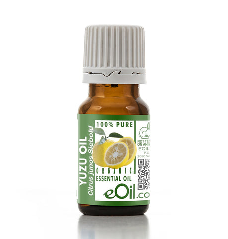 Yuzu oil bottle with green label on a white background