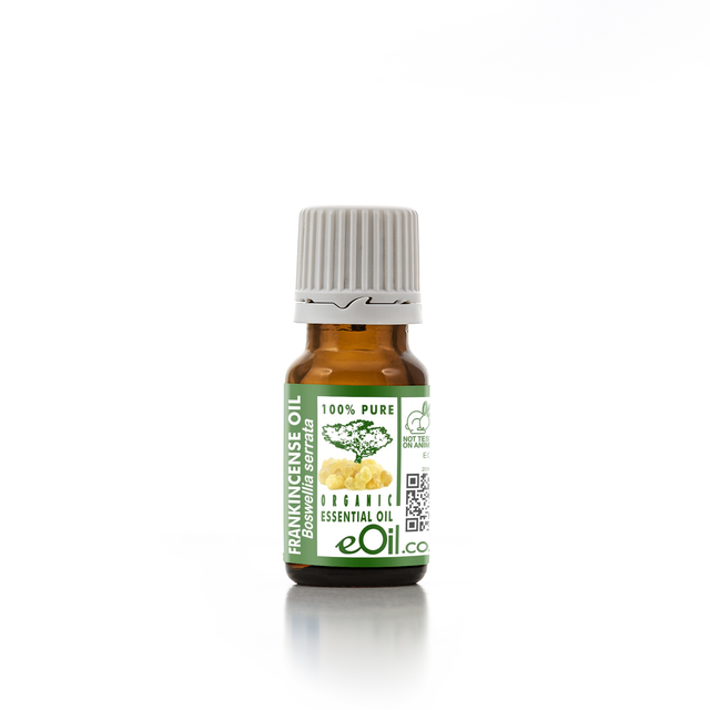 Essential oil bottle with a green label on a white background