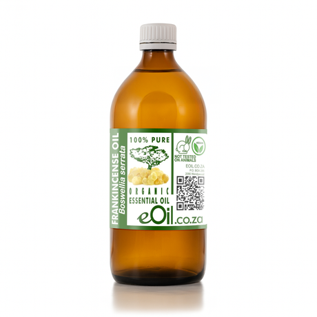 Bottle of frankincense oil with a label on a white background