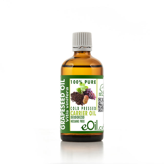 Bottle of grapeseed oil with a white background