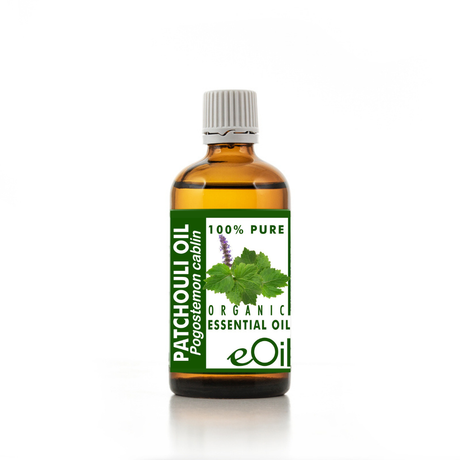 Bottle of patchouli oil with a green label on a white background